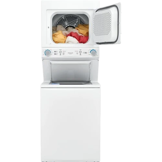 White stacked washer and dryer with open dryer door and a pile of laundry inside the dryer