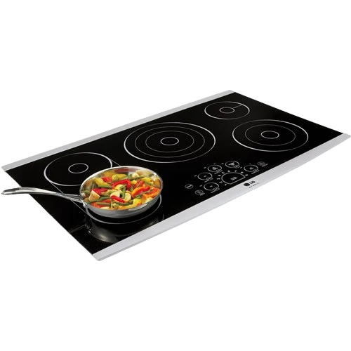 Black glass electric cooktop with four burners and a frying pan of colorful vegetables