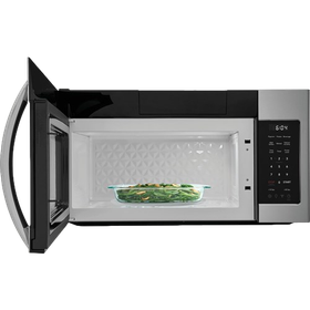 Open microwave with a glass dish of food inside on a white background
