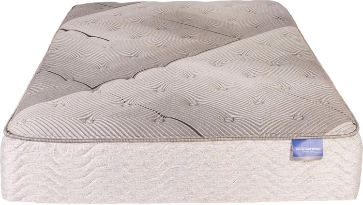 Beige quilted mattress with a patterned top and white fabric sides