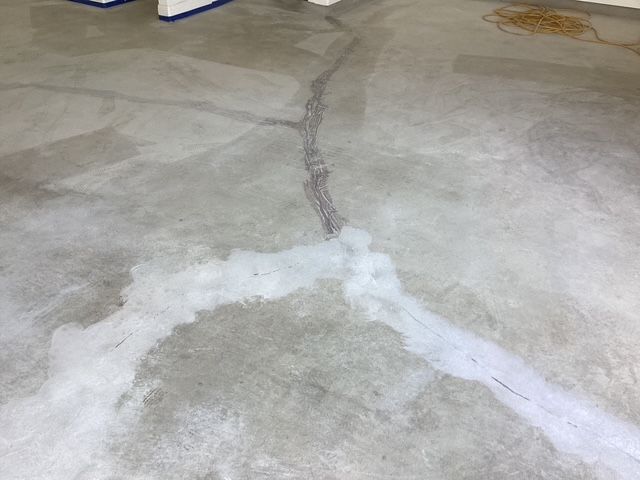 Concrete floor preparation for epoxy coating