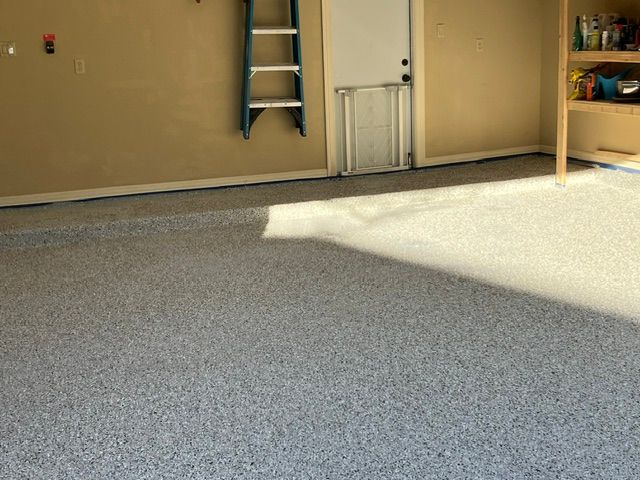 Decorative epoxy flake finish on a residential garage floor in Austin, TX