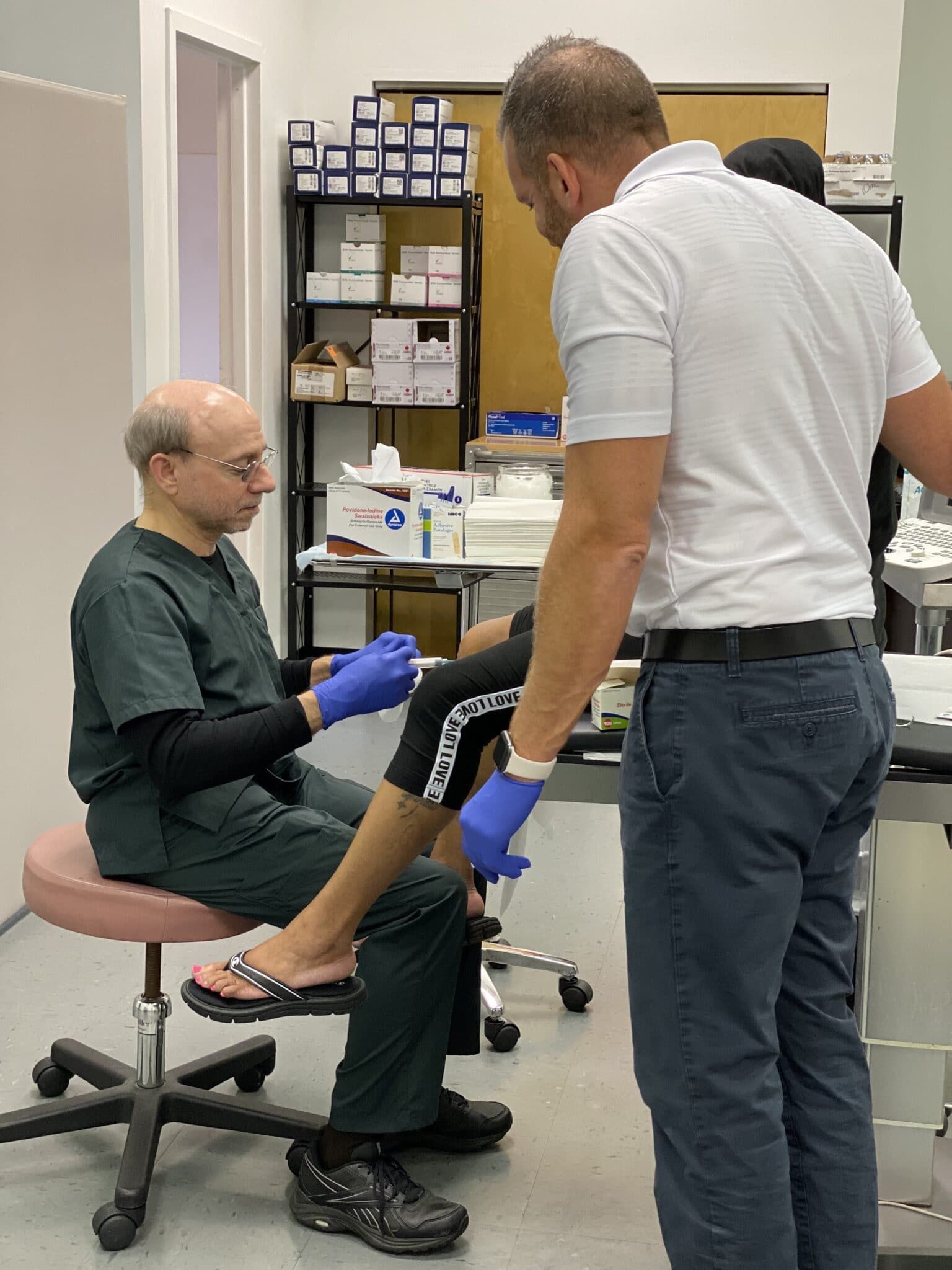 Michael Schina, Jr., M.D. and Dr. Jarrad Teller with a patient applying a Sciatic Nerve Block