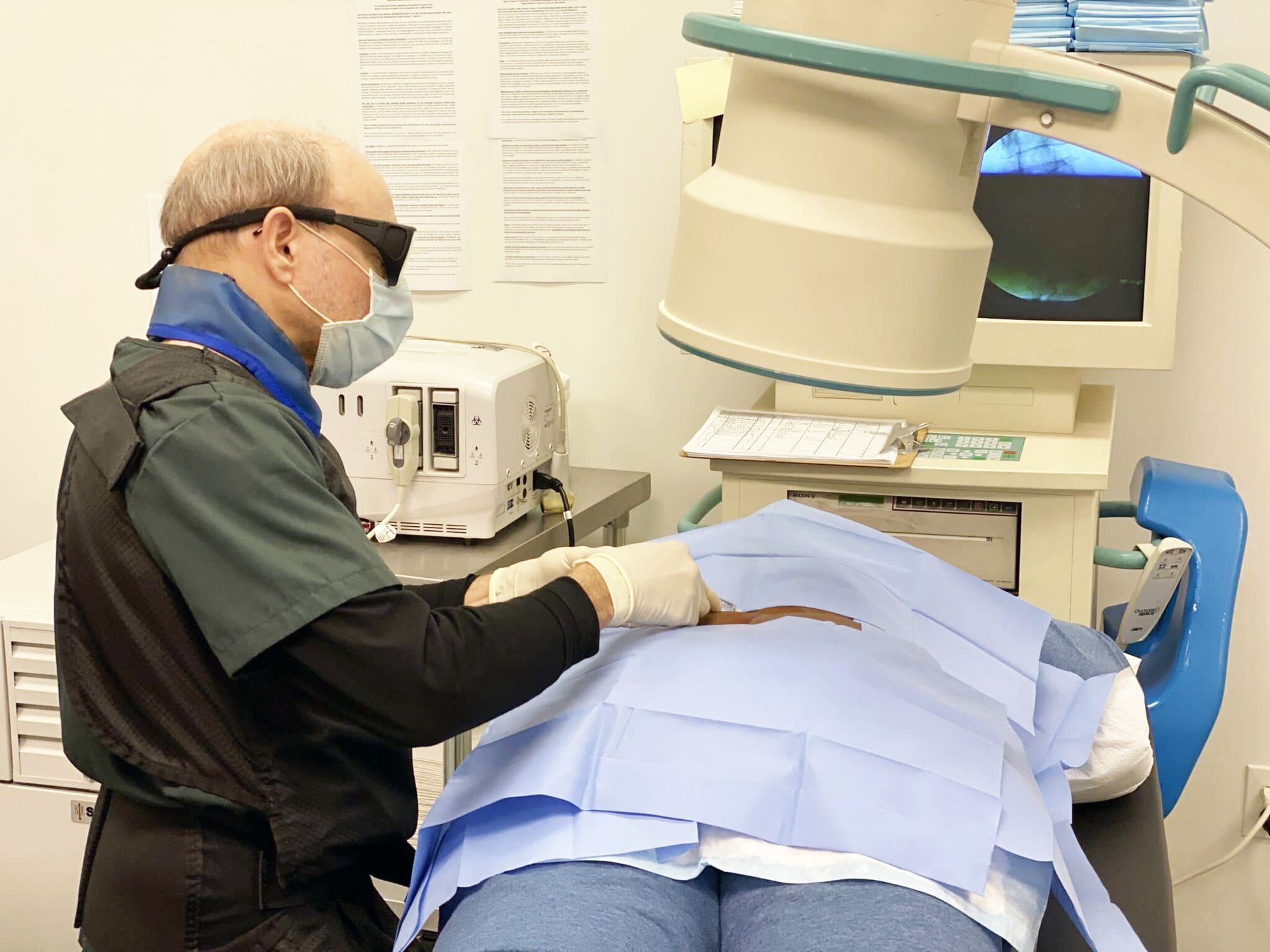 Michael Schina, Jr., M.D. is working on a patient