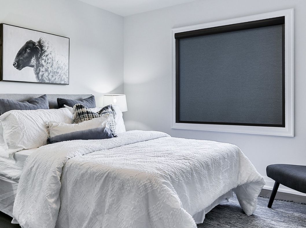 Norman® blackout shades covering a bedroom window.