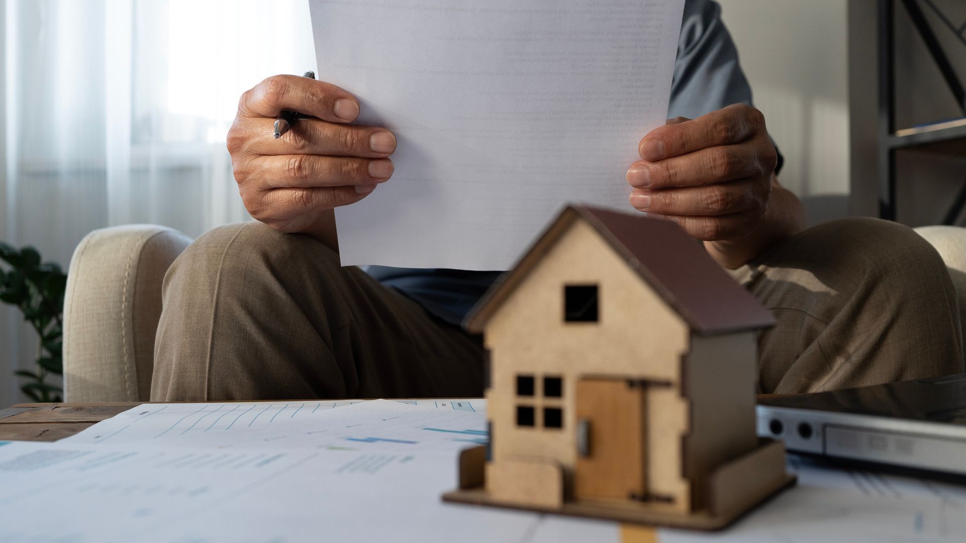 Senior man reading house contract. Senior man reading house contract.