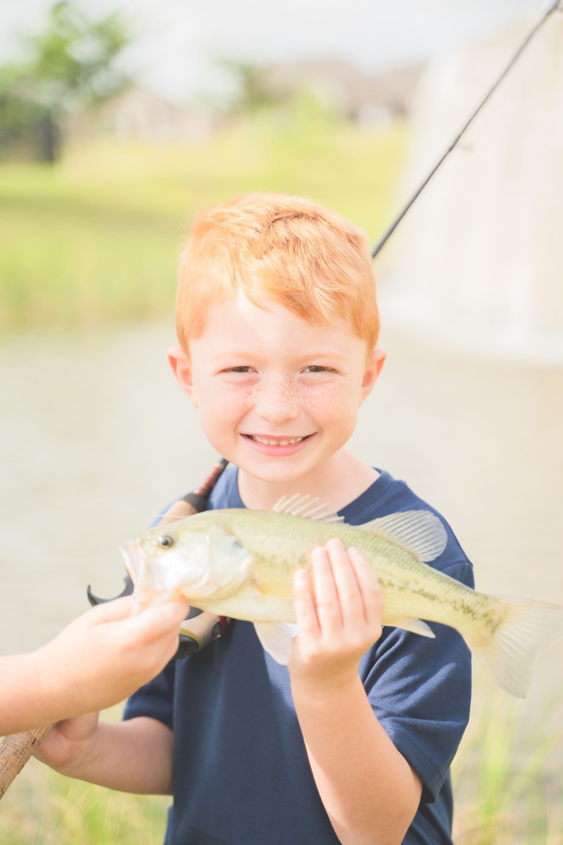Child Holding a Fish | Morningstar Homes