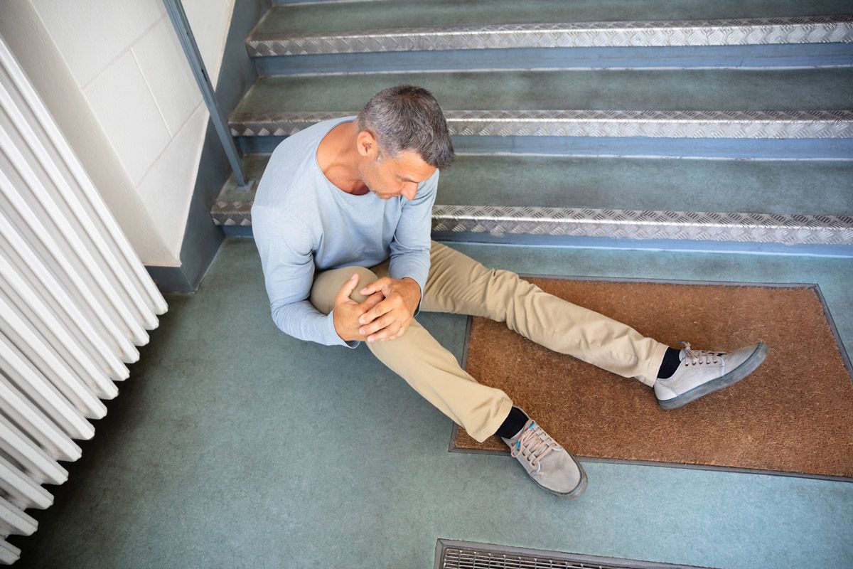 Man Sitting on Staircase After Slip and Fall Accident — Tacoma, WA — Vail, Cross-Euteneier & Associates
