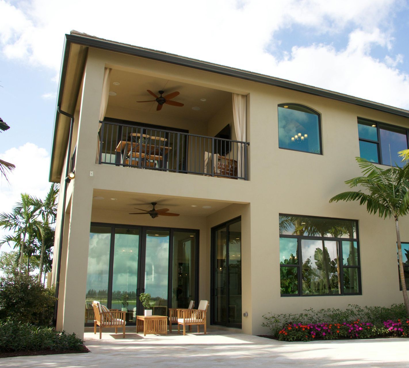 A large house with a balcony and lots of windows
