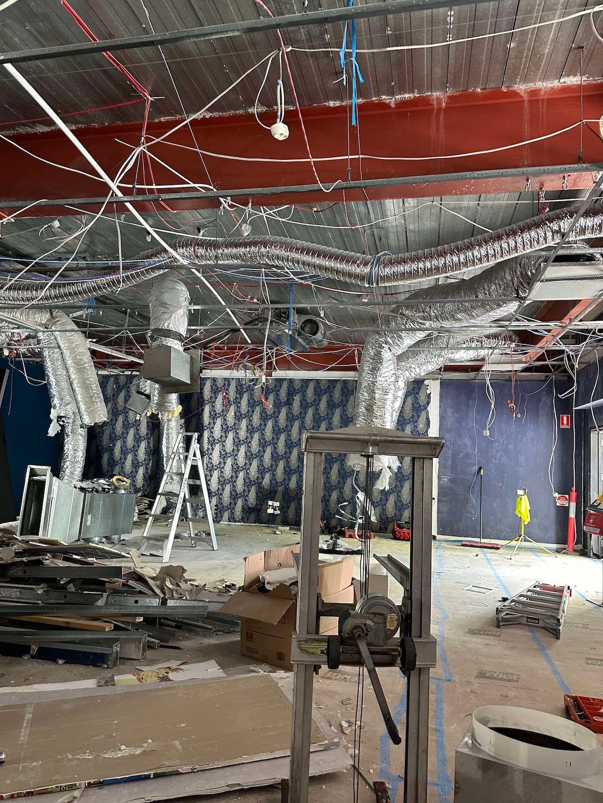 A large room with a lot of wires hanging from the ceiling.