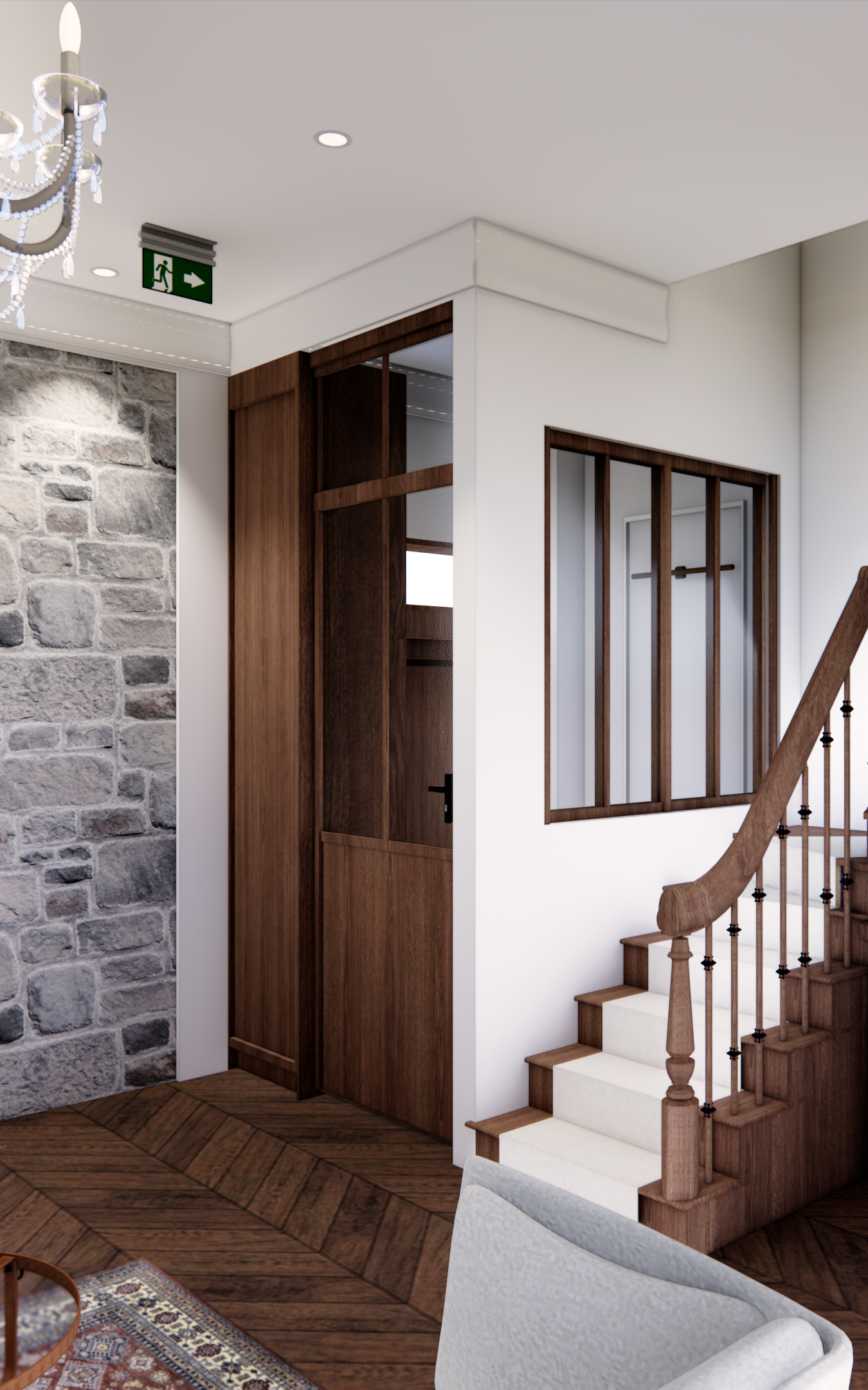 Vue intérieure : escalier en bois, porte avec rangements intégrés, mur en pierre.