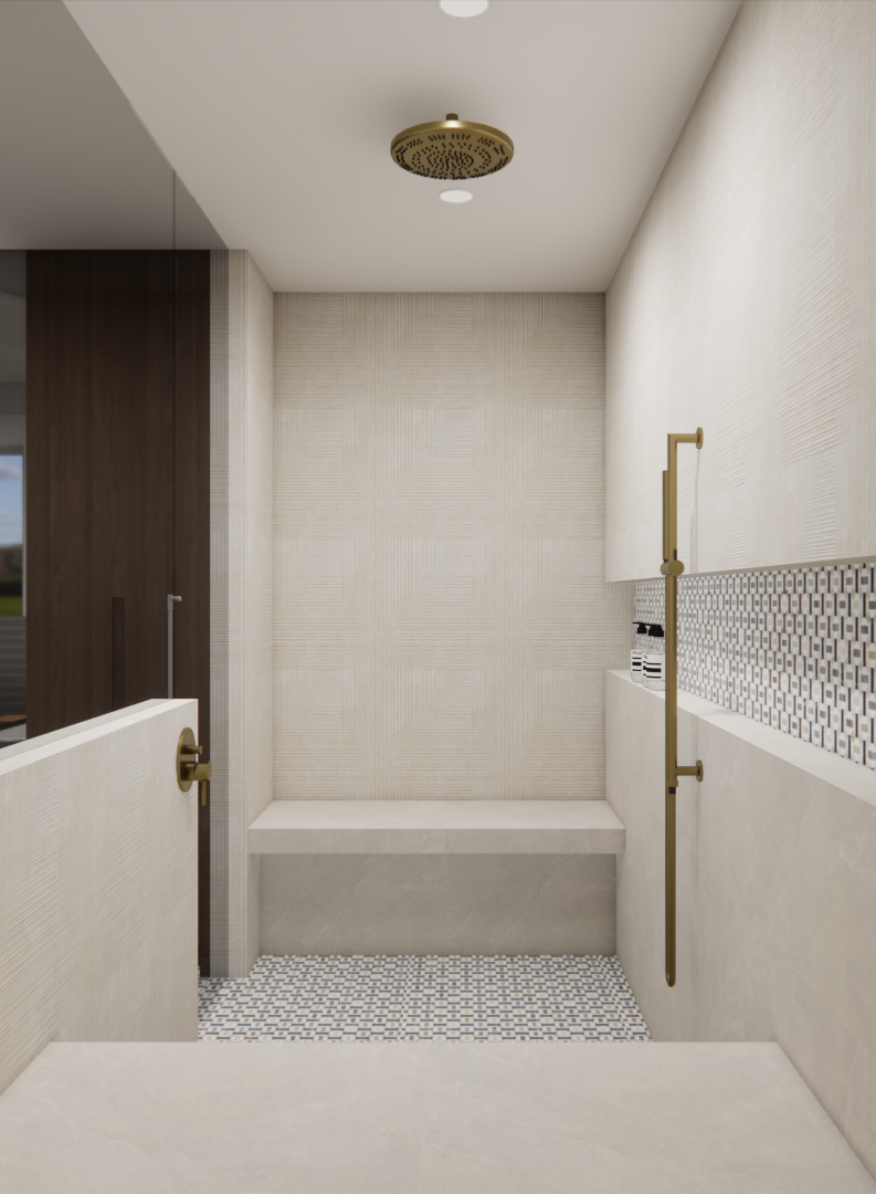 Une douche moderne avec carrelage beige, banquette intégrée, robinetterie en laiton et sol en galets.