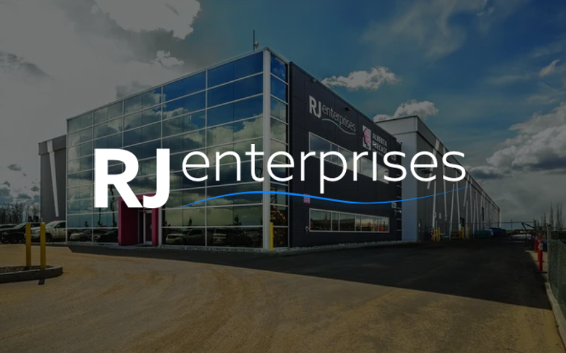 RJ Enterprises building, modern architecture, blue glass facade, exterior shot.