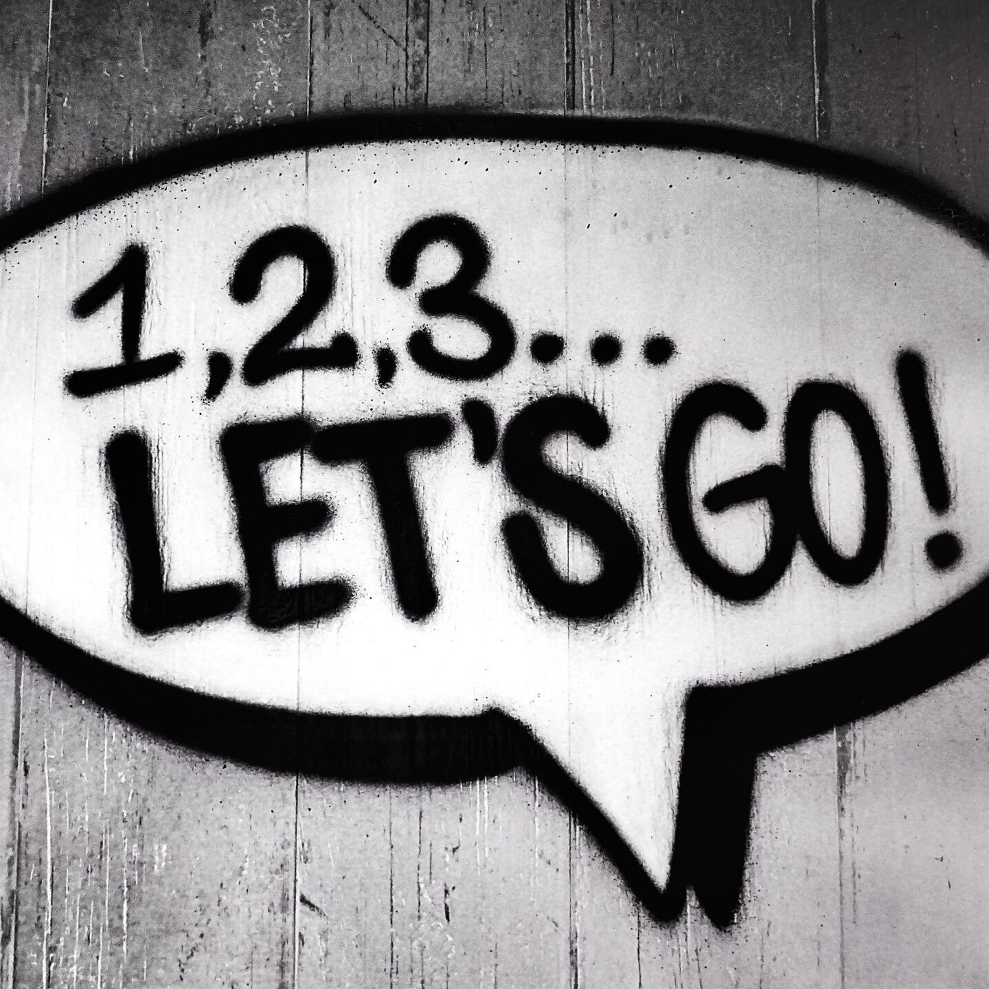 A black and white speech bubble with 
