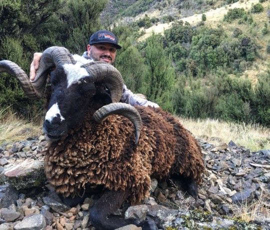 Joshua Godfrey hunting in the field on an international expedition