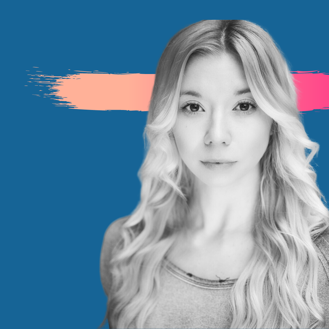 Woman with long wavy blonde hair, looking directly at camera. Dark blue background with coral and pink brushstrokes.