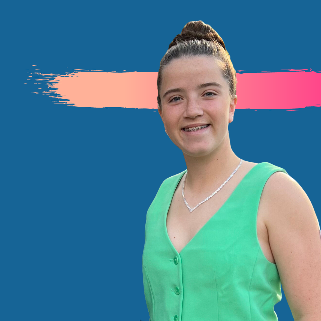 Young woman in a green top with a bun, smiles, set against a blue background with a pink and orange brush stroke.