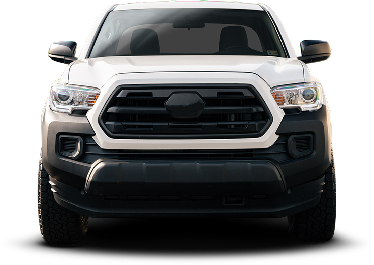 Three pickup trucks on white background, centered on a black truck with two white trucks behind it | Autotrendz