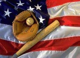 Baseball bat, glove, and ball on a waving U.S. flag background