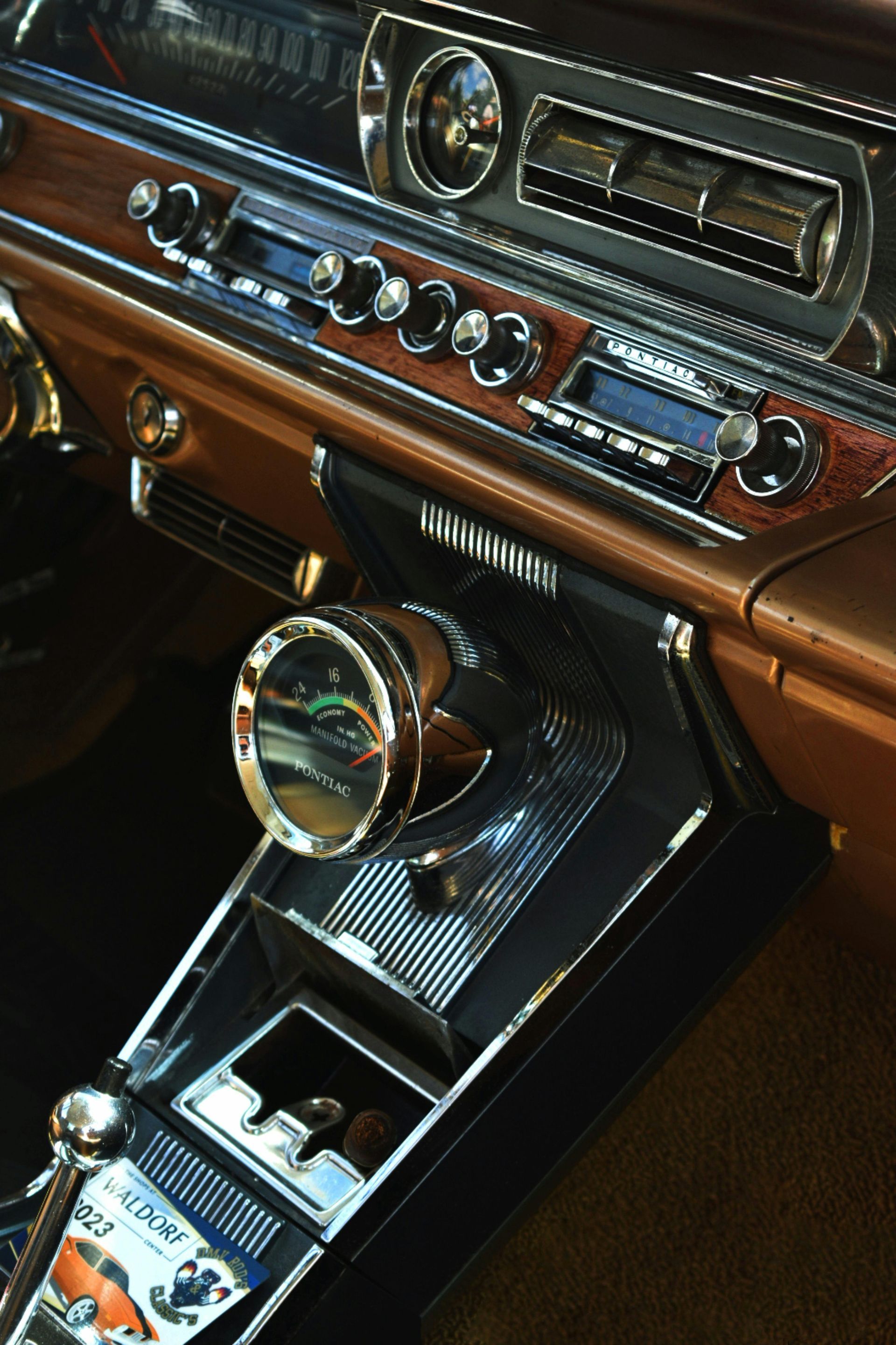 A close up of the dashboard of an old car