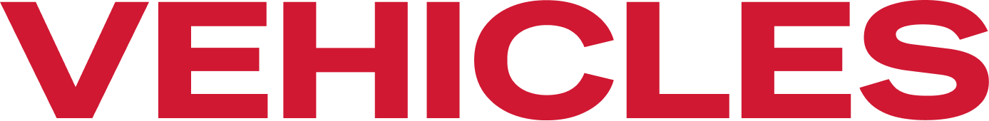 Red “VEHICLES” wordmark with a small yellow car icon above the text. | Sparks Tire & Auto