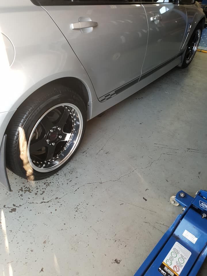 Silver car parked in the Budget Tyre Shed Charmhaven garage during professional tyre servicing for Central Coast customers