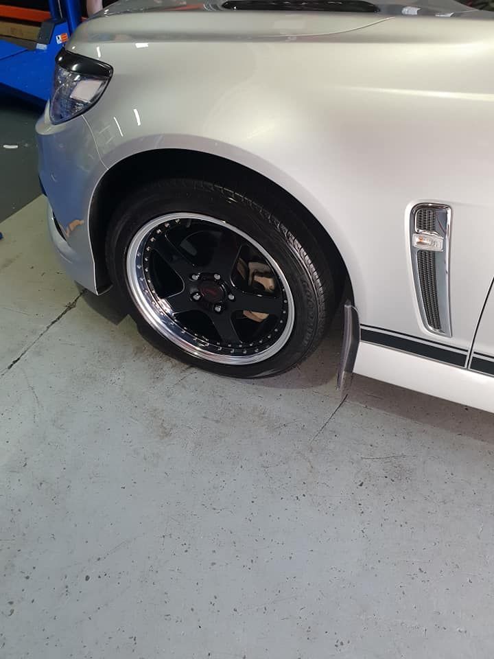 Silver car with black wheels parked in the Budget Tyre Shed Charmhaven garage for quality tyre services on the Central Coast