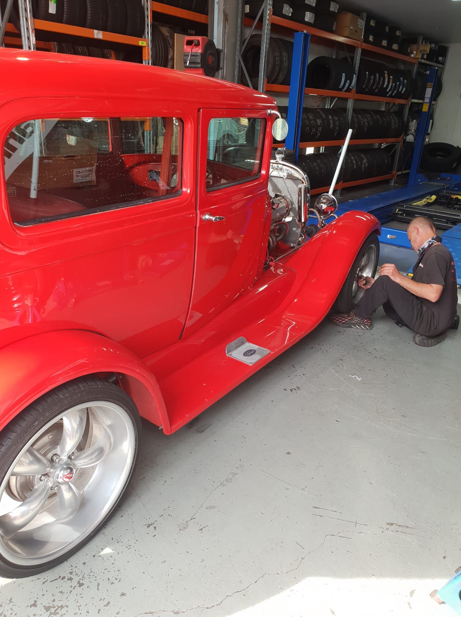 Technician balancing a tyre on professional equipment at Budget Tyre Shed Charmhaven, providing reliable tyre services on the Central Coast