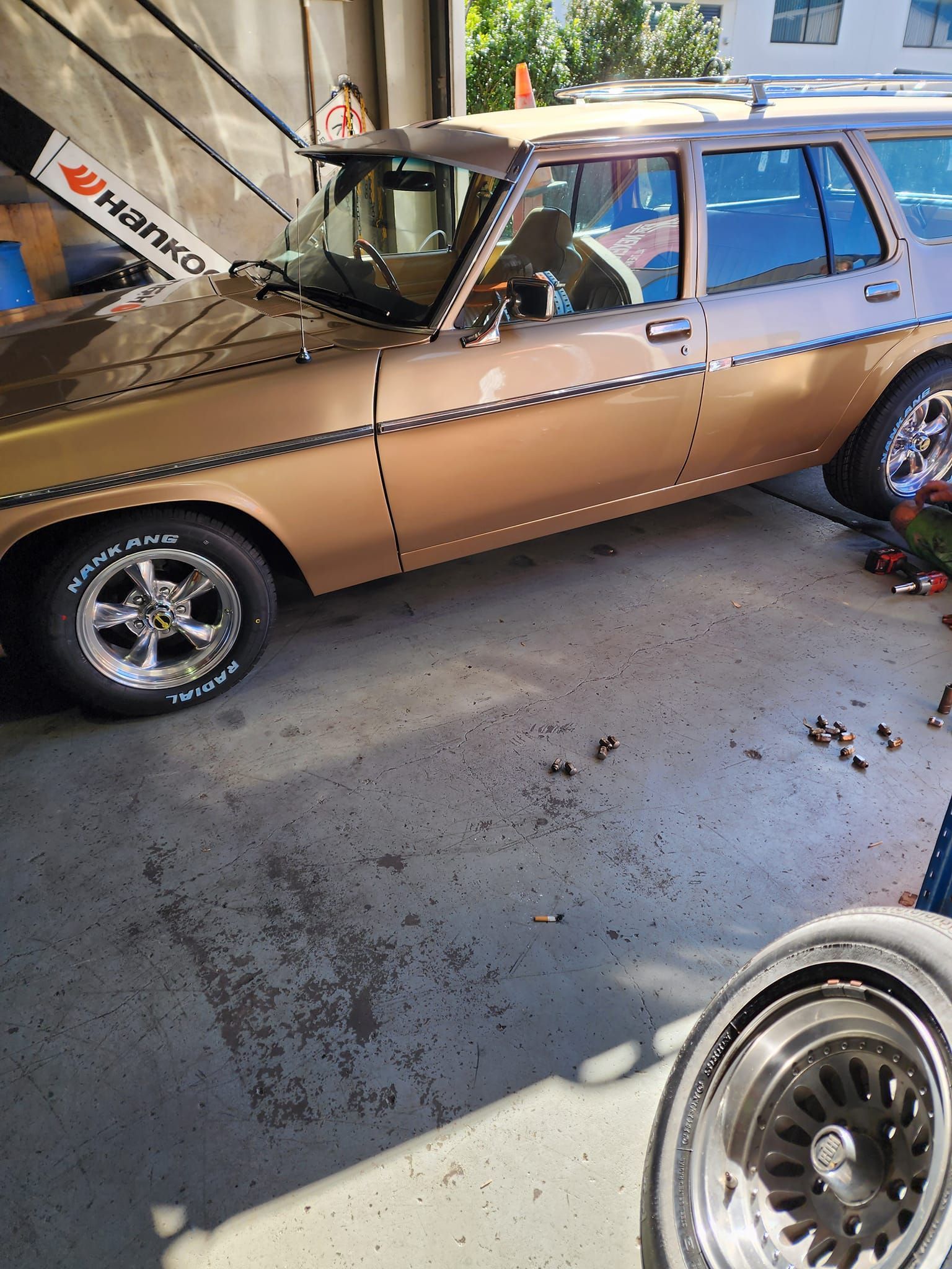 A Car Parked In A Mechanic Shop — Budget Tyre Shed In Charmhaven, NSW