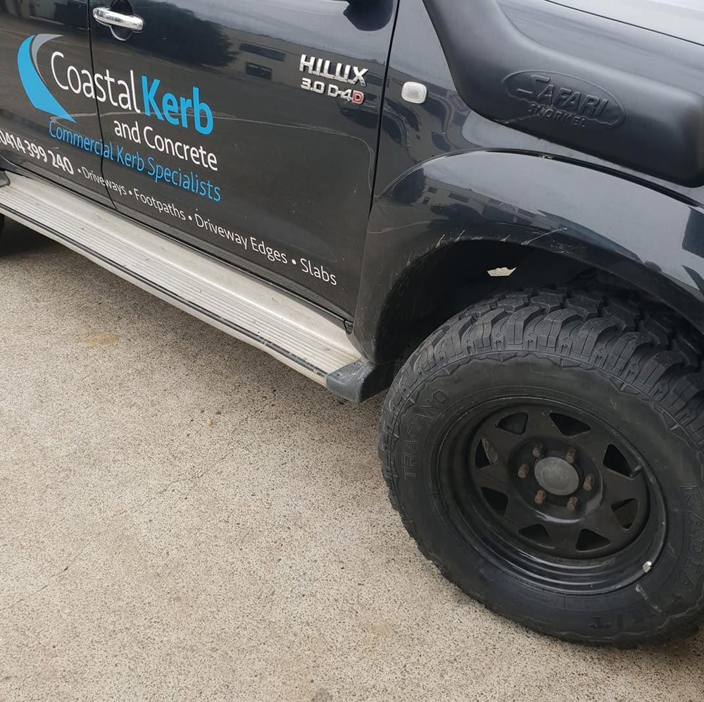 Black car fitted with dependable tyres at Budget Tyre Shed Charmhaven, delivering quality tyre solutions for Central Coast drivers