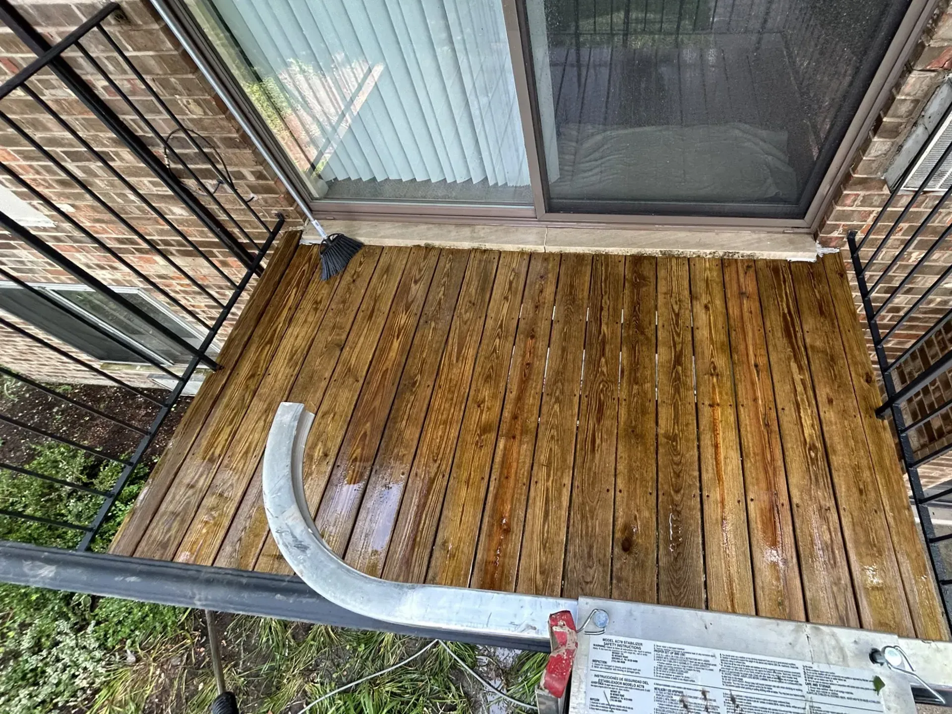Picture showing a deck cleaning  service in Palatine, IL. You Can see wood planks have been washed without damage to the wood. 