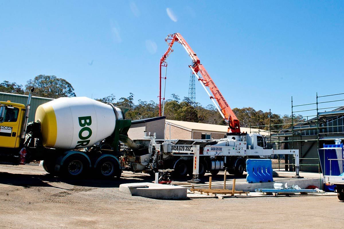 A Concrete Mixer With the Word Bob on It — Heritage Concrete In Uralla, NSW