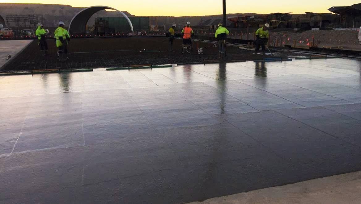 A Group of People Are Standing on Top of a Concrete Surface — Heritage Concrete In Uralla, NSW