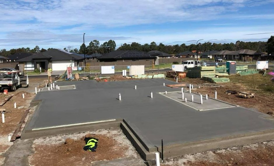 A Concrete Base For A House Is Being Built In A Residential Area — Heritage Concrete In Uralla, NSW