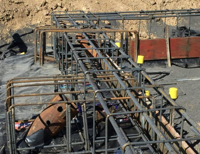A Construction Site With A Bunch Of Steel Bars — Heritage Concrete In Uralla, NSW