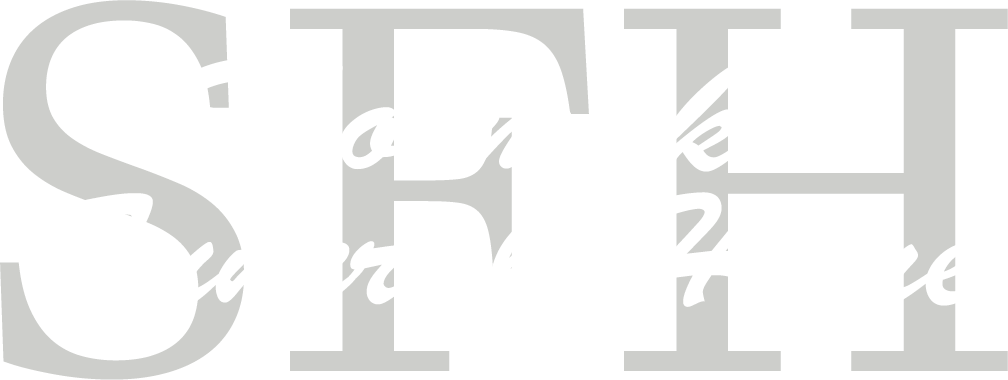Large white serif letters “SFT” on a light gray background.