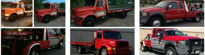 Assorted red tow trucks, some with flatbeds, outdoors.