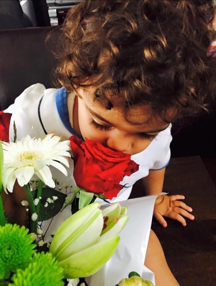 Kid Smelling Red Rose — Riverwood & Peakhurst, NSW — A Little Rei of Sunshine