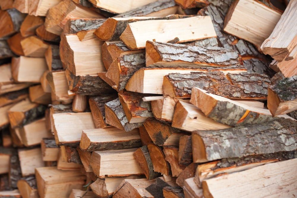 A Pile Of Logs Is Stacked On Top Of Each Other — Brown's Vegetation Management In Mulara, QLD
