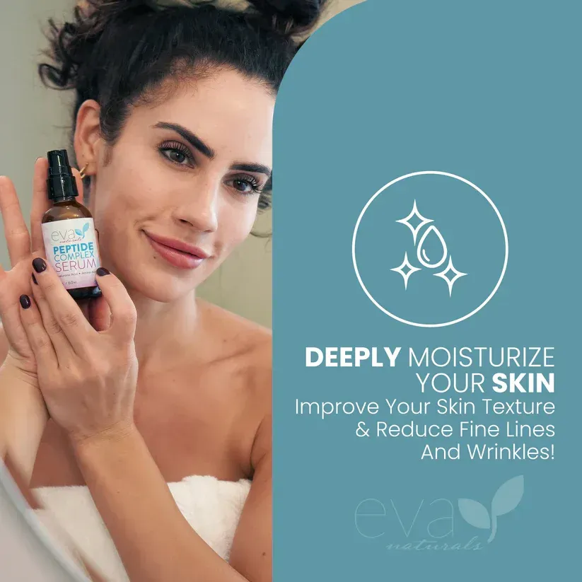 A woman is holding a bottle of moisturizer in front of her face.