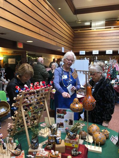 Women shopping at the Alternative Gift Market.
