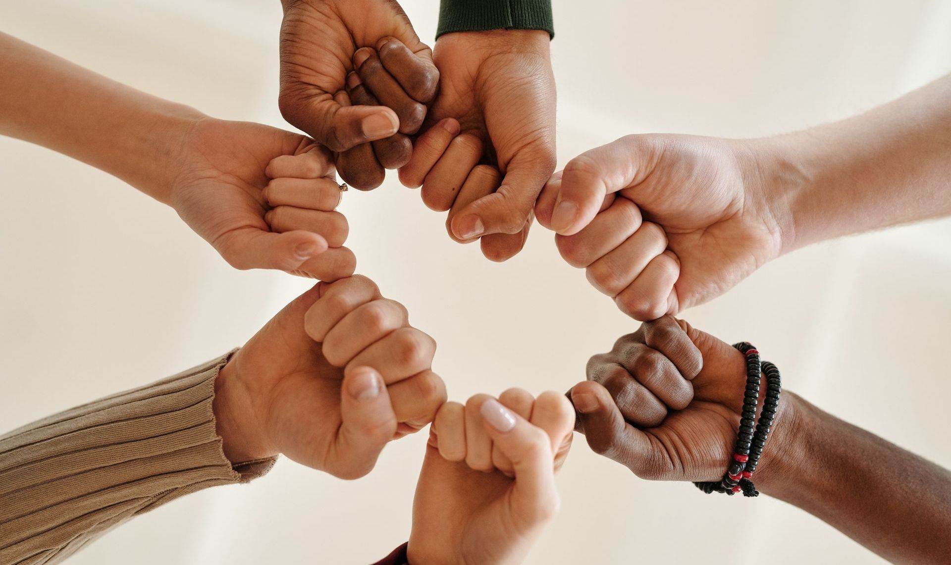 team of hands joined together