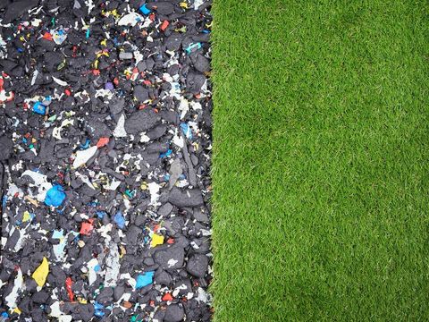 Shock-absorbing pads fitted under artificial grass for a play area
