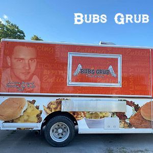 A Bubs Grub food truck featuring images of a burger, fries, and a man's portrait on its orange and white exterior.