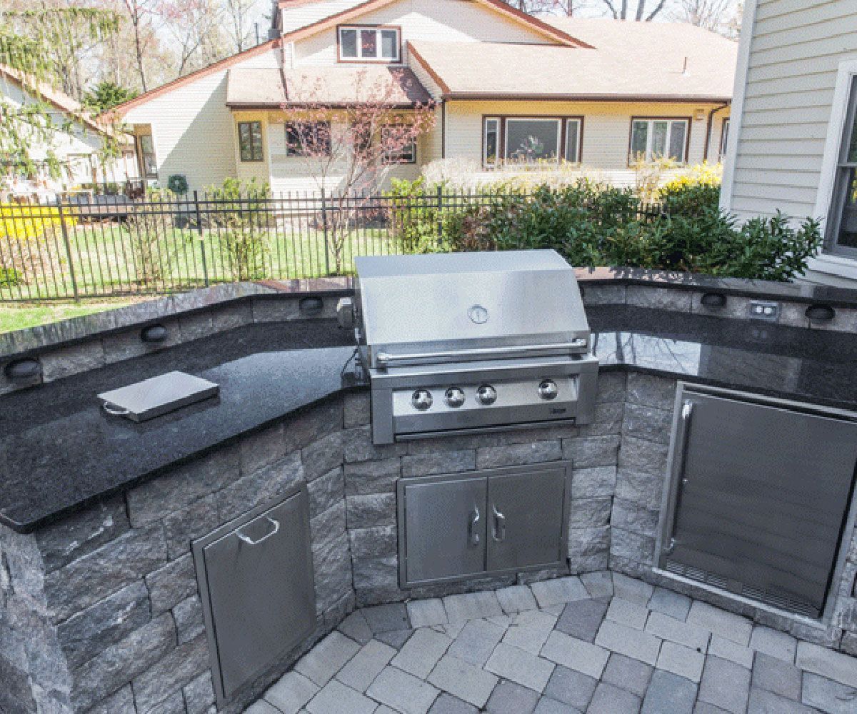 Custom leather side natural stone outdoor countertop on Bainbridge patio outdoor kitchen