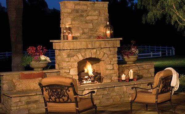 Backyard outdoor stone fireplace and pizza oven in Geneva Ohio