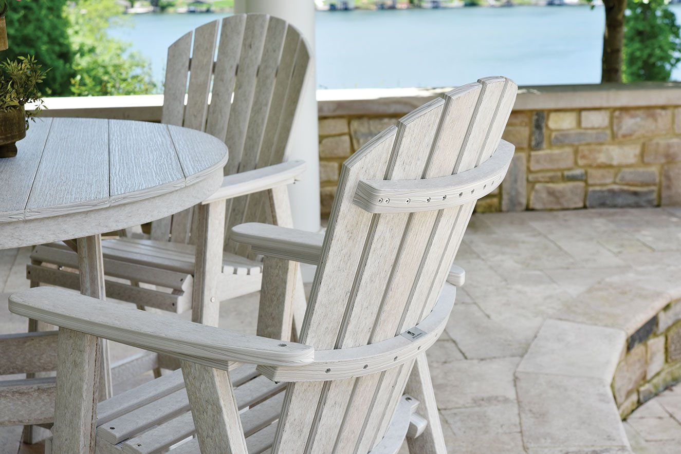 Custom round outdoor dining table and chairs on flagstone Ohio patio durable weather resistant