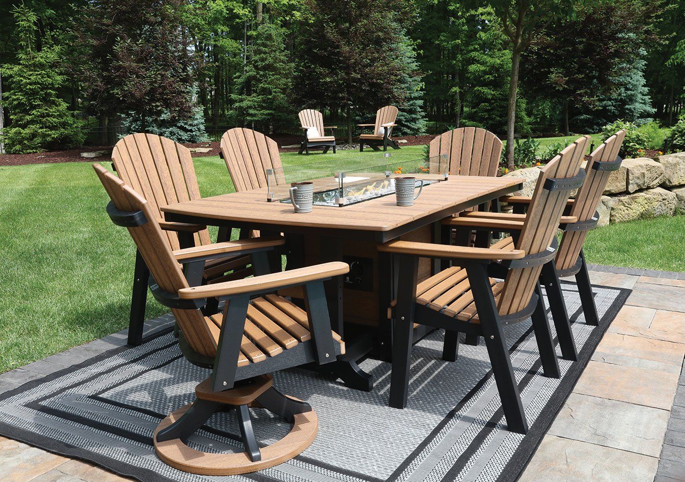 Custom amish outdoor fire dining table made from weather durable poly recycled lumber for backyard patio