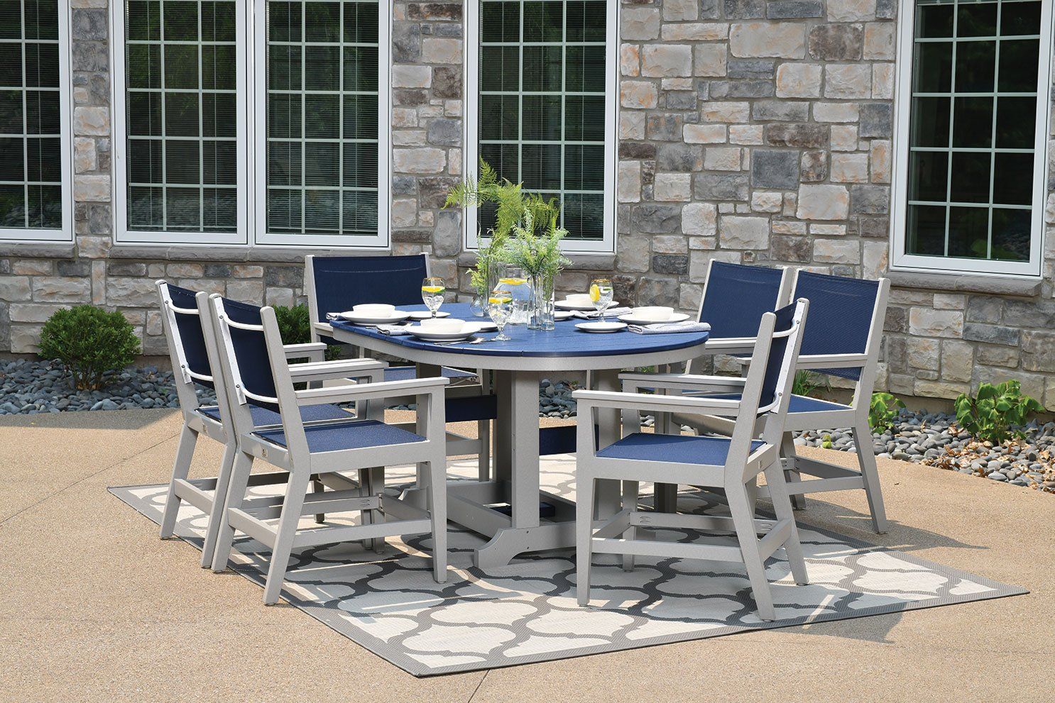 Ohio paver patio with oblong outdoor dining table made from recycled amish poly lumber weather resistant