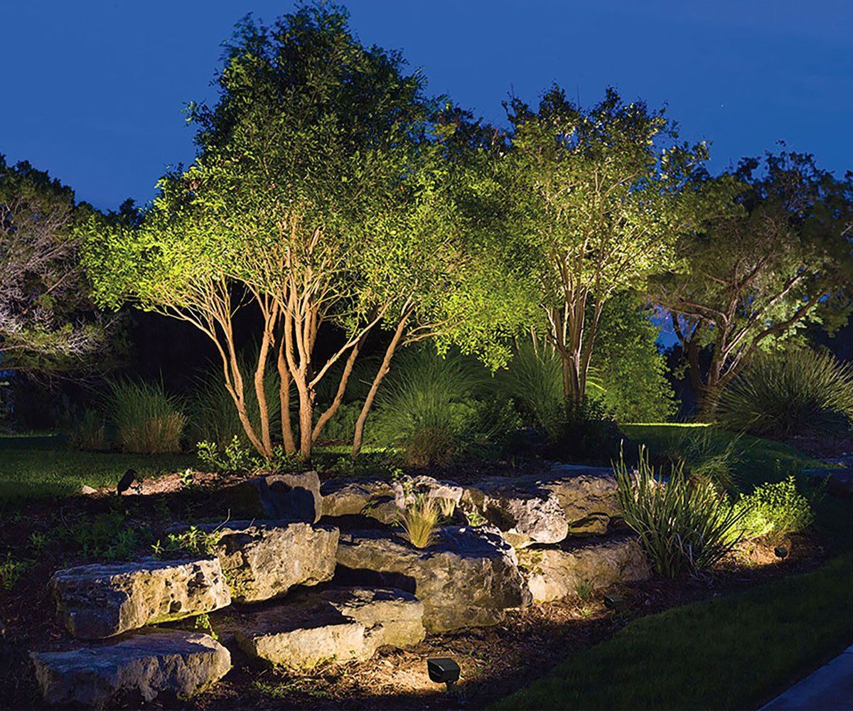 Uplighting and accent spot lighting Ohio backyard with trees and uplighting and landscape stone accent spot lights